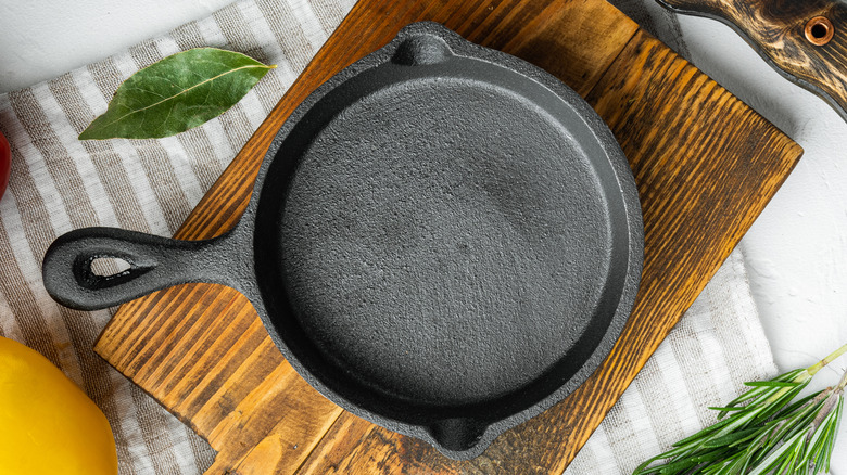 Cast iron skillet on a wooden cutting board