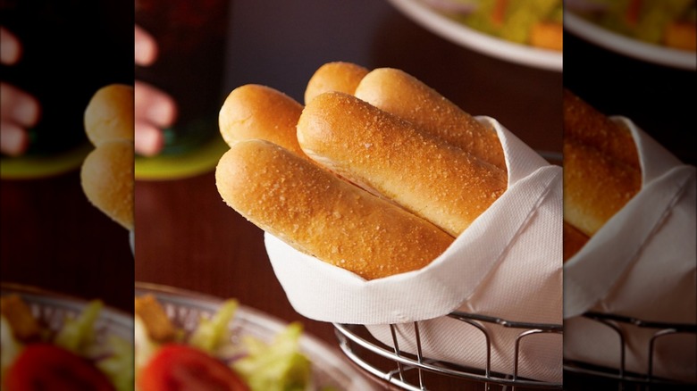 A basket of fresh breadsticks.