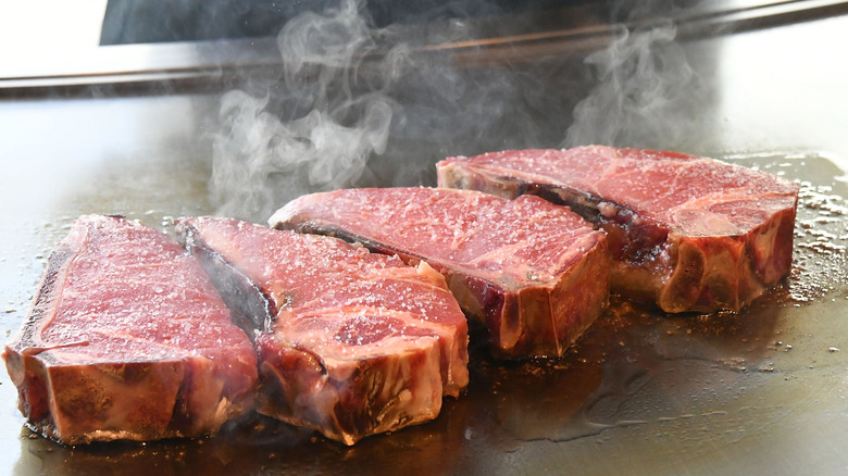 Prime beef cooking on griddle