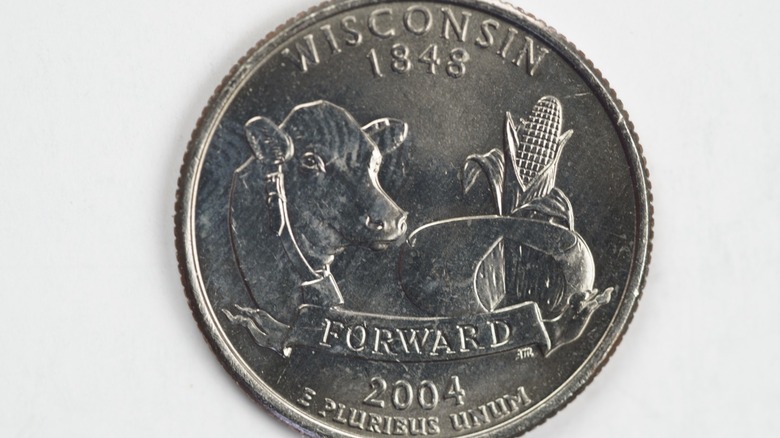 the Wisconsin commemorative quarter which has a cow and a round of cheese on it