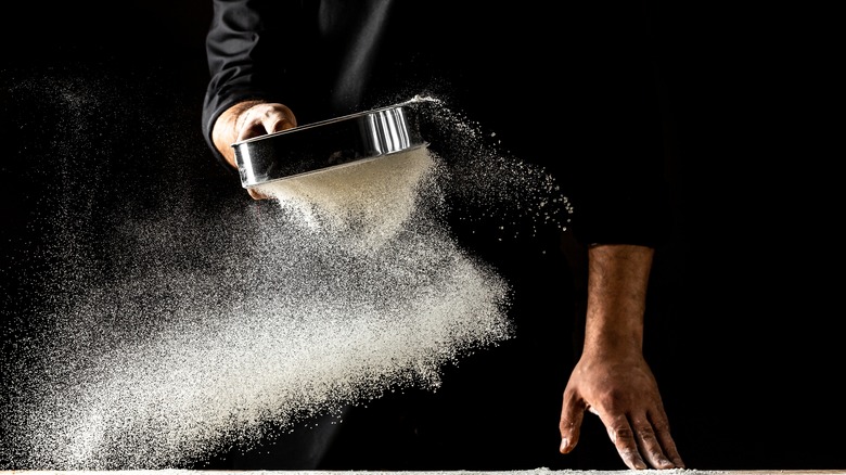 Flour sifting through a sieve