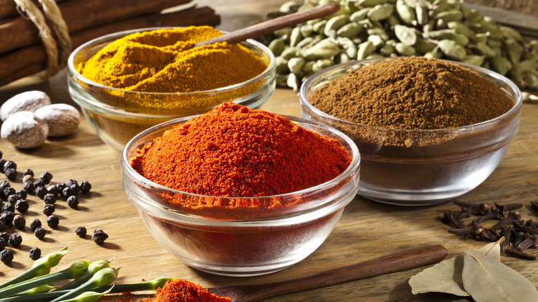 Spices in bowls and raw