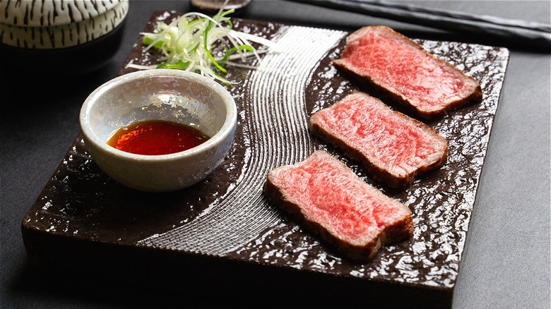 Wagyu meat on plate with sauce