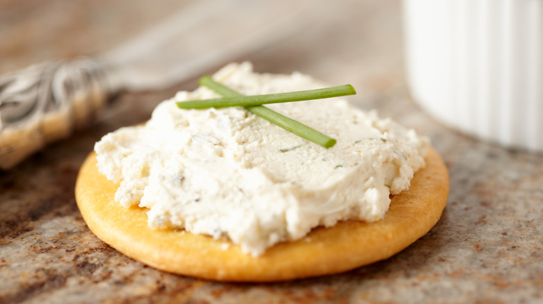 Boursin cheese spread on a cracker