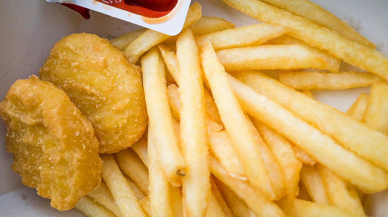 Chicken nuggets and fries with ketchup