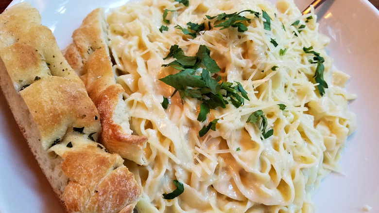 Fettucine alfredo with a side of bread