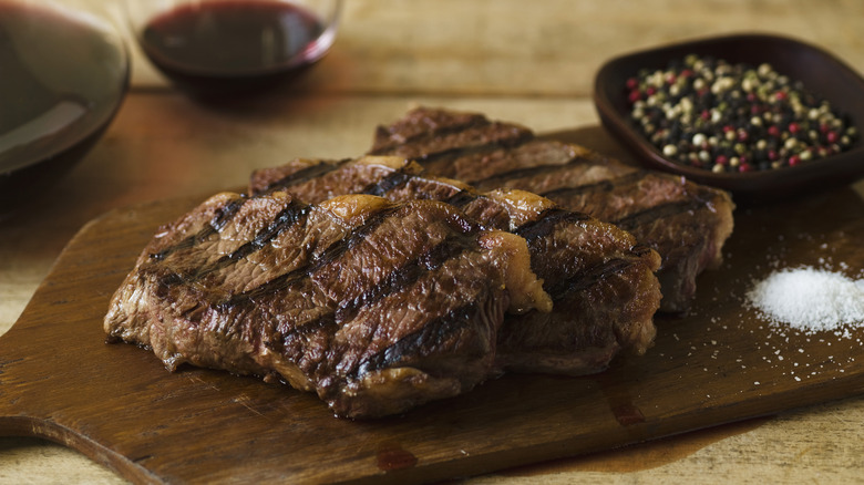 steak resting on cutting board 