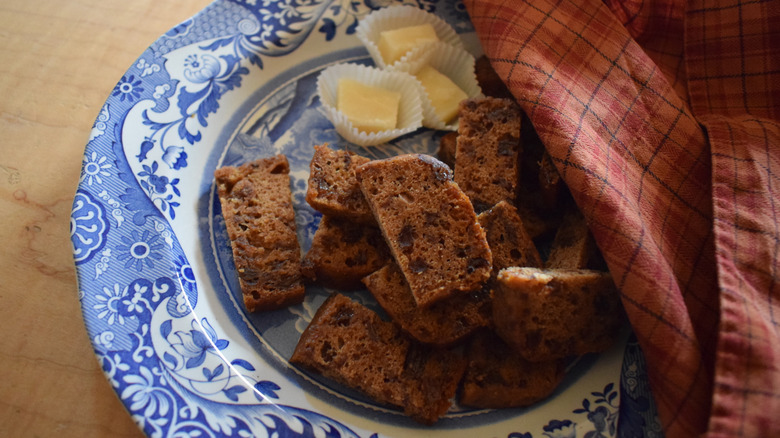 wartime cake with raisins sliced on a blue plate