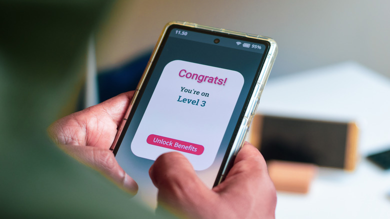 Person looking at rewards program on their phone