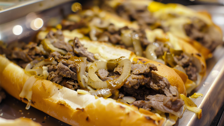 Philly cheesesteak rolls on metal tray