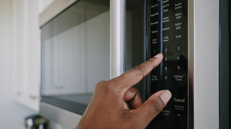 Person using a microwave