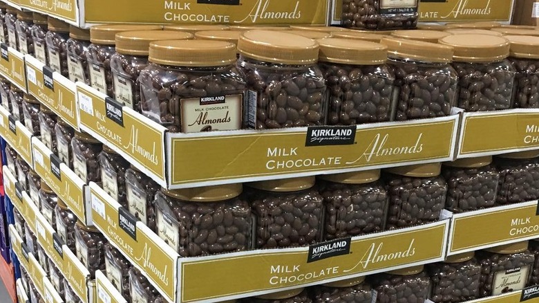 Stacked cardboard pallets of Kirkland chocolate-covered almonds