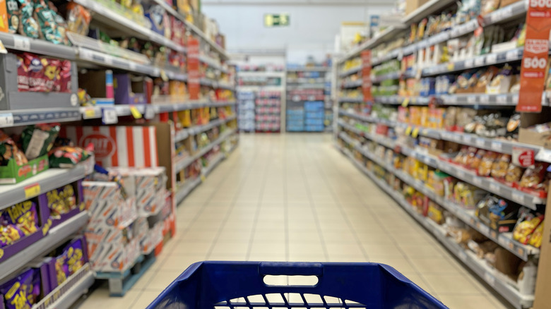 Shopping cart entering a grocery aisle