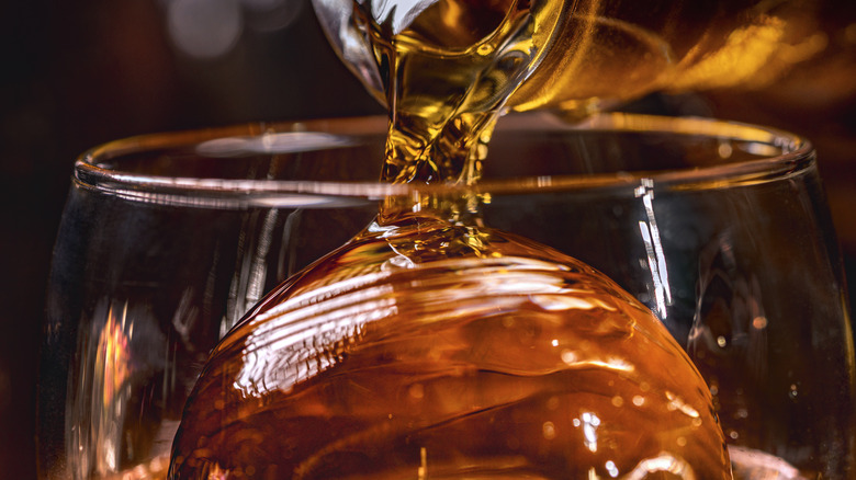 liquid poured over ice sphere 