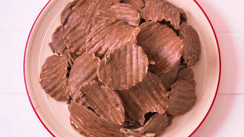 A plate of chocolate-covered ridged potato chips