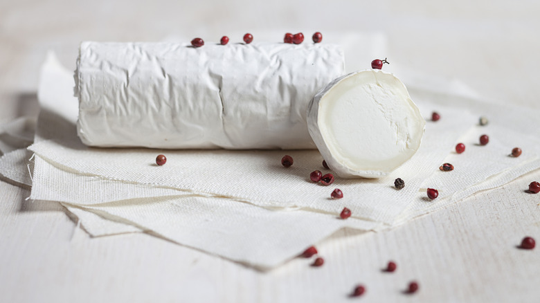 roll of goat cheese rolled in peppers