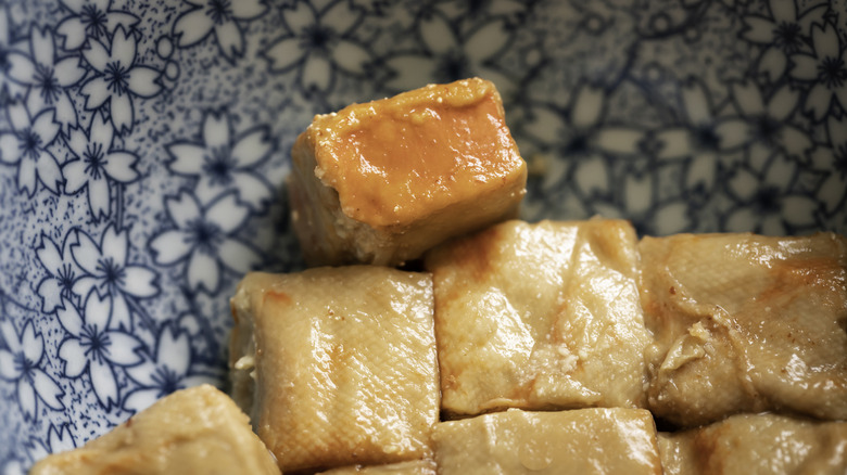 Small pieces of furu in a blue bowl