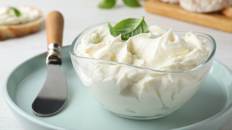 Cream cheese with knife for spreading