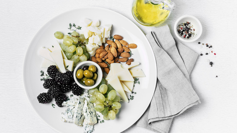 Cheese platter including blue cheese and olives