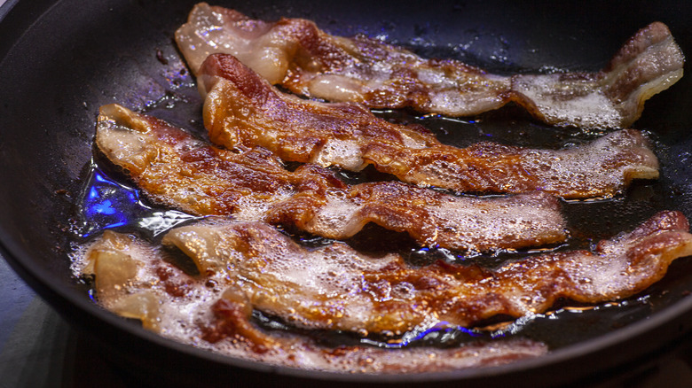 bacon frying in skillet