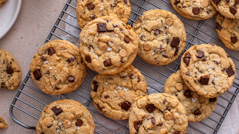 Chocolate chip cookies cooling on rack