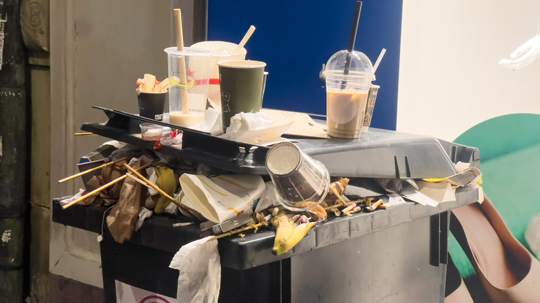 overflowing trash bin