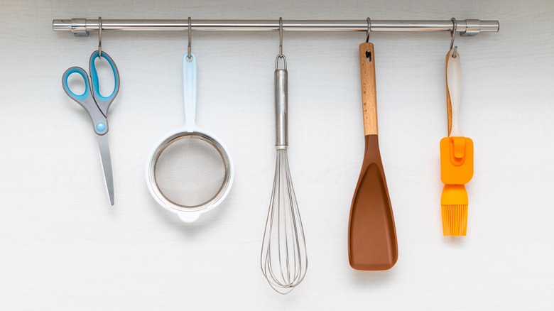 Slide hooks with small kitchen tools hanging