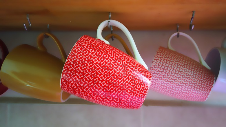 Mugs hanging on hooks