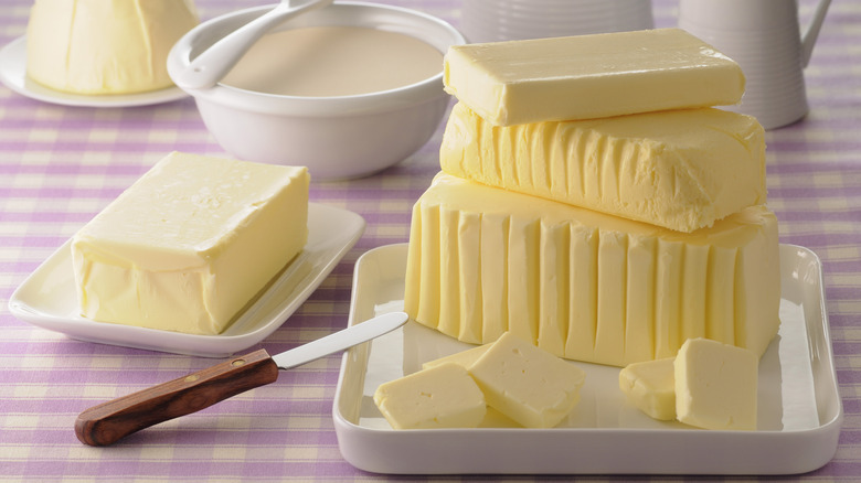 Blocks of butter on platters