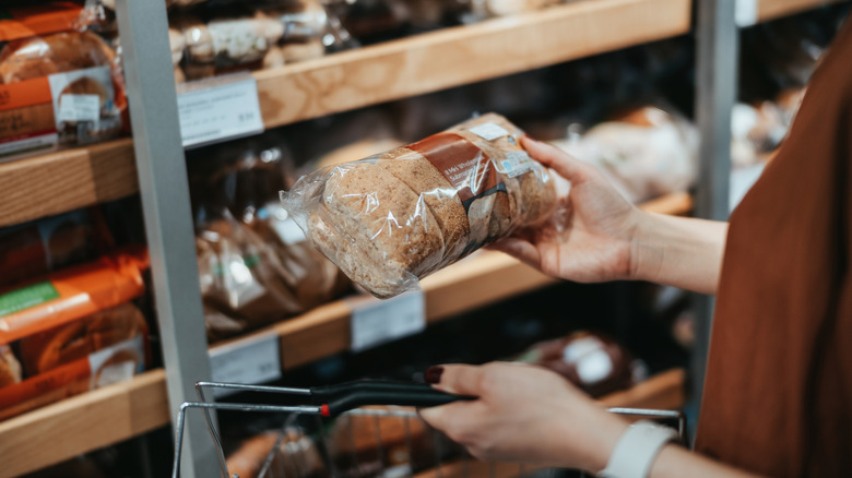 A person buying bread