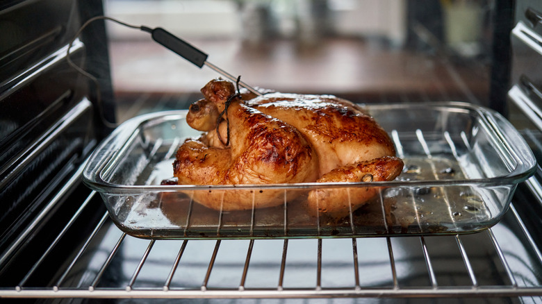 Chicken roasting with thermometer