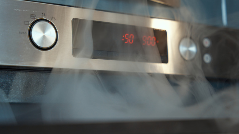Oven with smoke pouring out