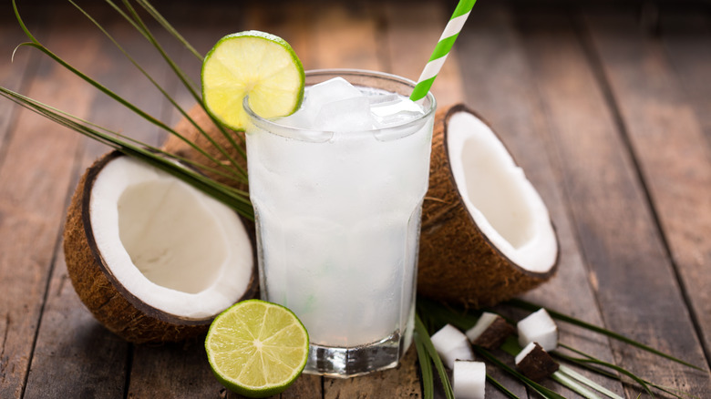 glass of coconut water and limes