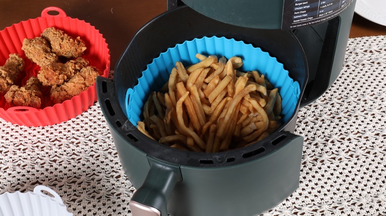 French fries inside silicon liner in air fryer