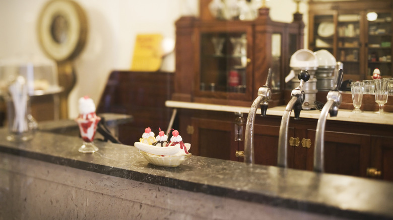 Ice cream sundae on the counter of a retro soda shop