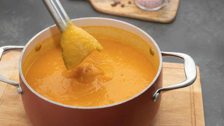 A pot of creamy squash soup