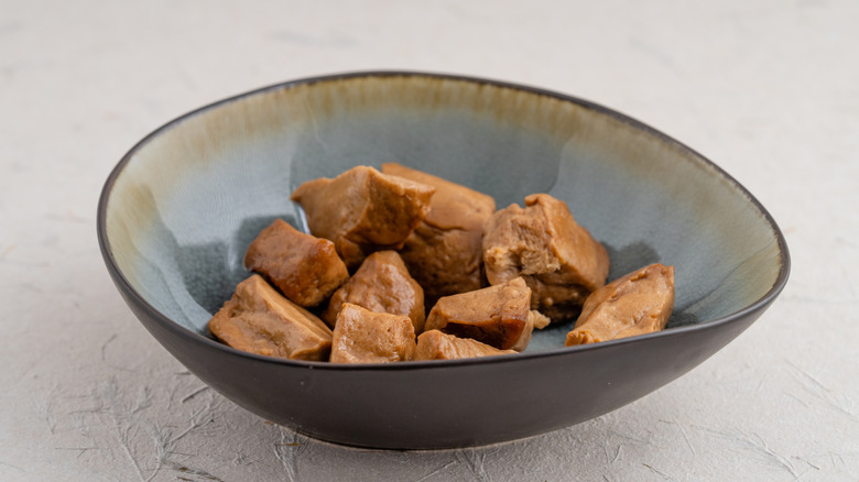 Uncooked pieces of seitan in a bowl