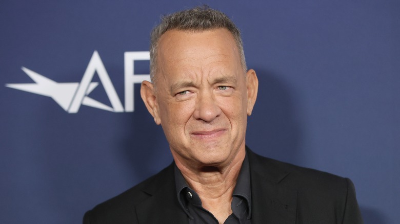 Tom Hanks smirking slightly