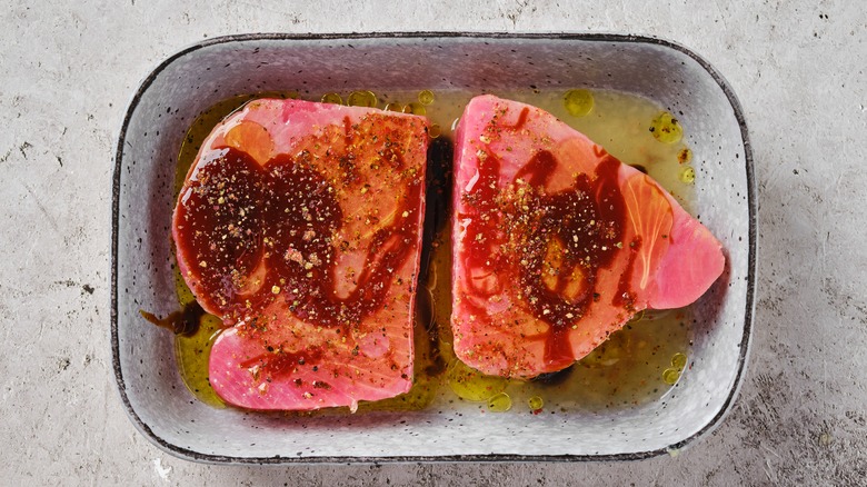 Ahi tuna marinating in bowl