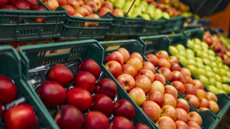 crates of apples in supermarket