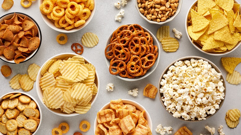 assorted snacks in small bowls