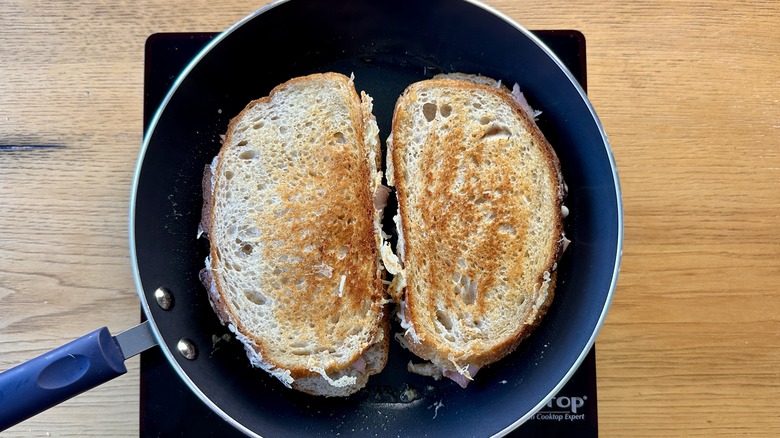 Sandwiches flipped to toast in pan