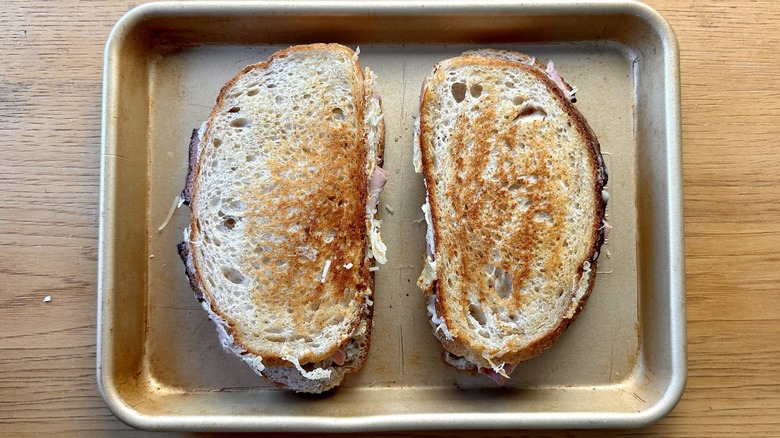 Toasted sandwiches on baking sheet