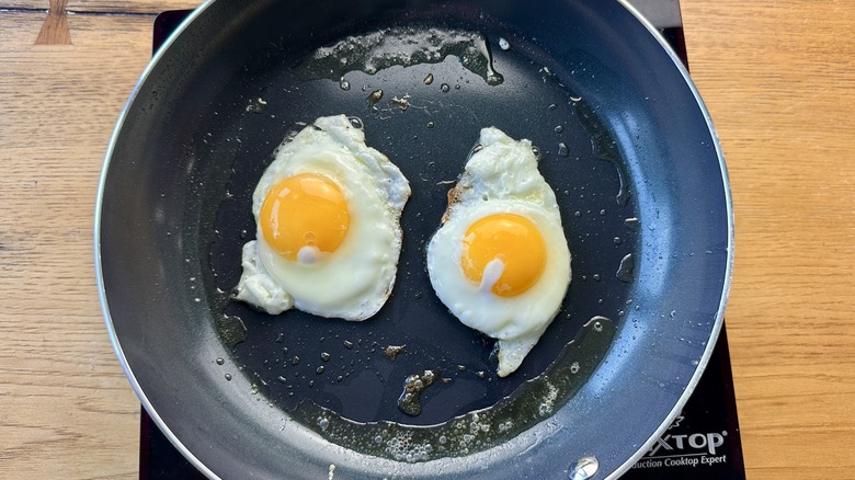 Fried eggs in pan