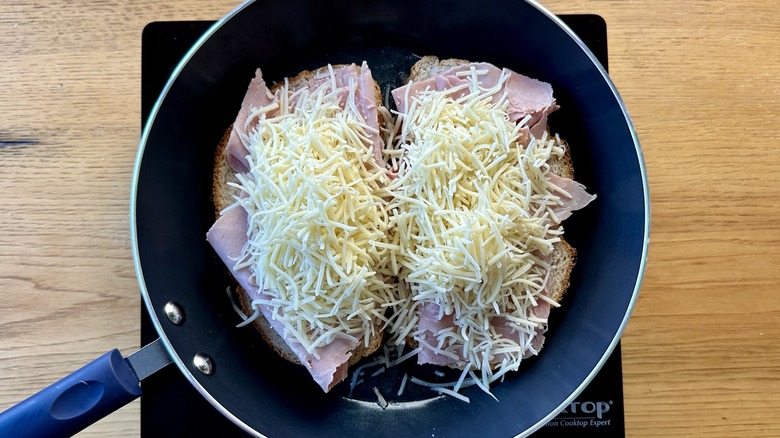 Ham and cheese over bread in pan