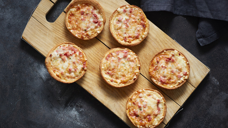 Mini pizzas on a wooden board