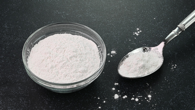 Baking powder in small bowl and spoon