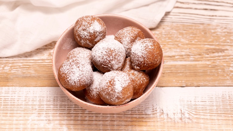 Bowl of powdered sugar donuts