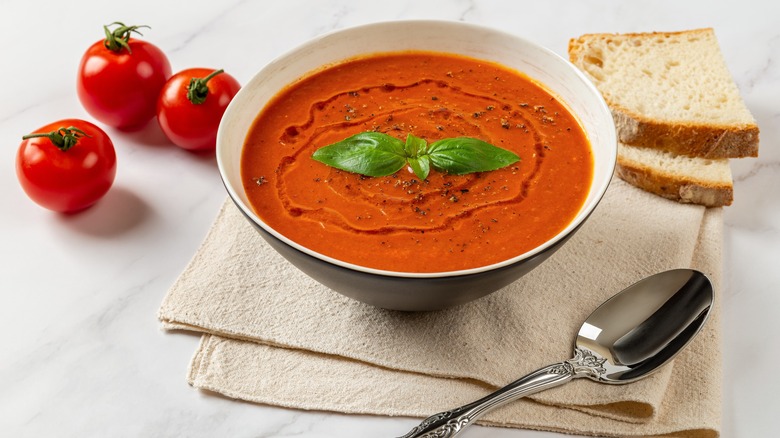 tomato soup topped with oil and basil