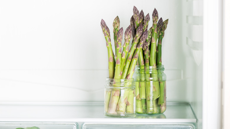 Asparagus in water jars